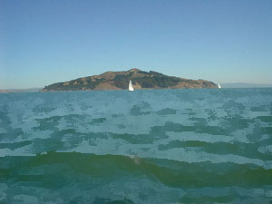 Sailboat in front of island